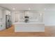 Modern kitchen boasts stainless steel appliances and a large center island at 5908 Sw 115 Street Rd, Ocala, FL 34476