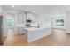 Modern kitchen features stainless appliances, a large island, and ample cabinet space at 5908 Sw 115 Street Rd, Ocala, FL 34476