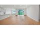 Open floor plan with wood flooring, recessed lighting and glass sliding doors at 5908 Sw 115 Street Rd, Ocala, FL 34476