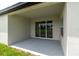 Covered patio offering a relaxing outdoor space with a sliding glass door and view of the yard at 5908 Sw 115 Street Rd, Ocala, FL 34476