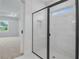 Shower with modern design including black frame and white tiling at 5908 Sw 115 Street Rd, Ocala, FL 34476