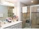 Bathroom with double vanity, tiled walk-in shower, and modern fixtures at 5963 Glory Bower Dr, Winter Garden, FL 34787