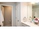 Well-lit bathroom featuring single vanity and a doorway to the toilet room at 5963 Glory Bower Dr, Winter Garden, FL 34787