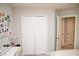Bedroom with closet, open doorway, and a vanity area at 5963 Glory Bower Dr, Winter Garden, FL 34787