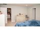 Bedroom features closet space and a decorative dresser with vanity area at 5963 Glory Bower Dr, Winter Garden, FL 34787