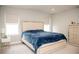 Light and airy bedroom with a large bed and natural light from the windows at 5963 Glory Bower Dr, Winter Garden, FL 34787