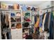 Organized walk-in closet featuring ample storage with shelves and hanging space at 5963 Glory Bower Dr, Winter Garden, FL 34787