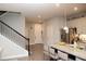 Open-concept kitchen featuring a granite island with seating and stainless steel appliances at 5963 Glory Bower Dr, Winter Garden, FL 34787