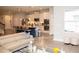 Open concept living space featuring kitchen island with seating and a comfortable sofa at 5963 Glory Bower Dr, Winter Garden, FL 34787
