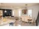 Bright, open-plan living area with dining and living spaces, complemented by modern finishes at 5963 Glory Bower Dr, Winter Garden, FL 34787