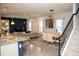 Bright, open-plan living area with dining and living spaces, complemented by modern finishes at 5963 Glory Bower Dr, Winter Garden, FL 34787