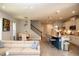 Bright, open-concept living space featuring a stylish kitchen, dining area, and comfortable seating at 5963 Glory Bower Dr, Winter Garden, FL 34787
