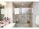 Luxurious tiled walk-in shower with glass enclosure and built-in bench at 5963 Glory Bower Dr, Winter Garden, FL 34787