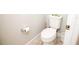 Clean and simple half bath with toilet and essential fixtures in a neutral palette at 5963 Glory Bower Dr, Winter Garden, FL 34787