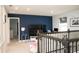 Upstairs with a TV, workspace, and railing at 5963 Glory Bower Dr, Winter Garden, FL 34787