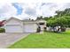 Charming single-story home with a manicured lawn and a two-car garage, offering curb appeal at 604 Timberwilde Ct, Winter Springs, FL 32708