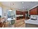 Spacious kitchen featuring custom wood cabinets, stainless steel appliances, and elegant countertop, ideal for cooking at 604 Timberwilde Ct, Winter Springs, FL 32708