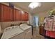 Laundry room featuring a washer, dryer, and cabinet storage with a utility sink at 604 Timberwilde Ct, Winter Springs, FL 32708