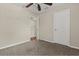 The bedroom is spacious with a walk-in closet, neutral carpet, and light paint at 6874 Slaven Dr, Orlando, FL 32819
