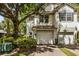 Exterior shot of a two-story home with a two car garage and brick paved driveway at 6874 Slaven Dr, Orlando, FL 32819