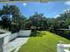 Tranquil backyard view with a detached garage and lush greenery, providing a serene outdoor escape at 714 Springdale Rd, Orlando, FL 32804
