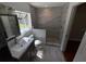 Updated bathroom featuring a walk-in shower with modern tile and a sleek vanity at 714 Springdale Rd, Orlando, FL 32804