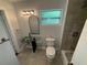 Stylish bathroom featuring a unique glass sink, sleek mirror, and updated fixtures at 714 Springdale Rd, Orlando, FL 32804