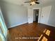 Bright bedroom with hardwood floors, classic trim, and a ceiling fan for added comfort at 714 Springdale Rd, Orlando, FL 32804