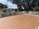 Spacious wooden deck perfect for outdoor entertaining and relaxing, with white railing at 714 Springdale Rd, Orlando, FL 32804