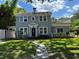 Charming two-story home with landscaped yard and stone pathway to the front entrance at 714 Springdale Rd, Orlando, FL 32804