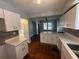 Newly renovated kitchen with island, white cabinets, and modern finishes at 714 Springdale Rd, Orlando, FL 32804