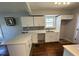 Modern kitchen with white cabinets, countertop space and updated appliances at 714 Springdale Rd, Orlando, FL 32804