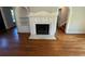The inviting living room showcases a fireplace with hardwood flooring and is ready for your design touches at 714 Springdale Rd, Orlando, FL 32804
