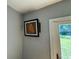 An artwork featured in a room with views of the yard and an open doorway at 714 Springdale Rd, Orlando, FL 32804