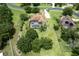 Beautiful aerial view of a property with an in-ground pool, a large backyard, and a well-maintained lawn at 748 Mills Estate Pl, Chuluota, FL 32766