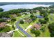 An aerial view of a luxury neighborhood overlooking a lake at 748 Mills Estate Pl, Chuluota, FL 32766