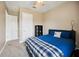 A simply furnished bedroom with a ceiling fan and ample lighting at 748 Mills Estate Pl, Chuluota, FL 32766