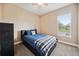 Comfortable bedroom featuring a ceiling fan and a window with bright natural light at 748 Mills Estate Pl, Chuluota, FL 32766