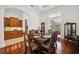 Formal dining area with hardwood floors, designer furnishings, and sliding door access to patio at 748 Mills Estate Pl, Chuluota, FL 32766