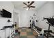 Bright exercise room with gym equipment, tile flooring and a ceiling fan at 748 Mills Estate Pl, Chuluota, FL 32766