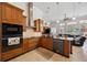 Modern kitchen with stainless steel appliances, granite countertops, and abundant cabinet space at 748 Mills Estate Pl, Chuluota, FL 32766