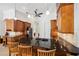 The kitchen has wood cabinets, granite countertops, and stainless steel appliances at 748 Mills Estate Pl, Chuluota, FL 32766