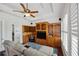 Built-in shelving surrounds a TV and provides storage in this cozy living room space at 748 Mills Estate Pl, Chuluota, FL 32766