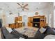 Open-concept living room features a fireplace, built-ins and connects to the kitchen at 748 Mills Estate Pl, Chuluota, FL 32766