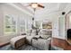 Comfortable living room boasts natural light, stylish furniture, and access to an outdoor patio area at 748 Mills Estate Pl, Chuluota, FL 32766