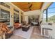 Covered outdoor patio features a complete kitchen and dining area with a view of nature at 748 Mills Estate Pl, Chuluota, FL 32766