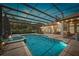 Resort-style screened pool with spa and ample seating, perfect for entertaining at 748 Mills Estate Pl, Chuluota, FL 32766