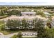 View of the building that shows off the gorgeous golf course view and peaceful residential neighborhood at 7509 Mourning Dove Cir # 204, Reunion, FL 34747