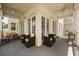 Expansive wrap-around covered balcony with ceiling fans and comfortable seating areas for relaxing and entertaining at 7509 Mourning Dove Cir # 204, Reunion, FL 34747