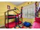 Bright bedroom with bunk beds, colorful decor, and a ceiling fan at 7509 Mourning Dove Cir # 204, Reunion, FL 34747